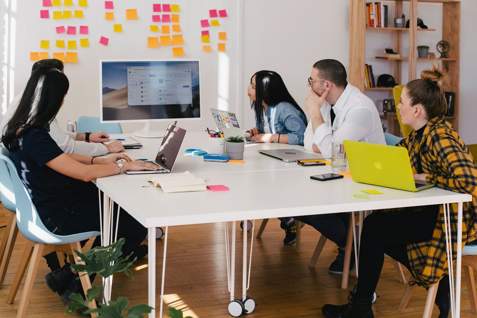 Colleagues collaborating over a plan in the office