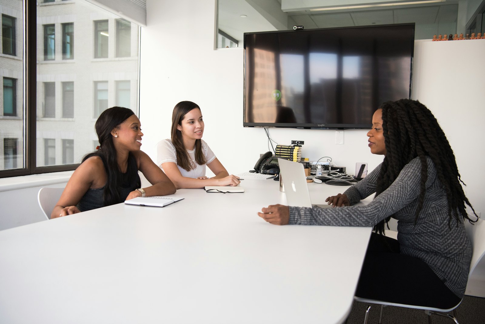 Advisers in a working session around a meeting table